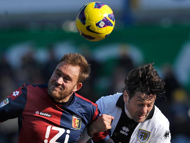 Parma's Massimo Gobbi and Genoa's Andreas Granqvist battle for the ball on February 10, 2013