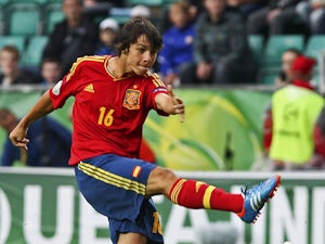 Spain's Oliver Torres has a shot during the UEFA European Under-19 Championship on July 15, 2012