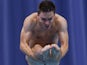 British diver Olly Dingley competes in the men's 1m springboard event during the Commonwealth Games on October 10, 2010
