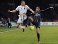 Paris Saint Germain's defender Gregory Van Der Wiel challenges for the ball on February 8, 2013
