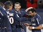 Paris Saint Germain's forward Ezequiel Lavezzi is congratulated by teammates after scoring in his side's match with Bastia on February 8, 2013