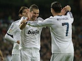 Real Madrid goalscorer Karim Benzema celebrates with teammates on February 9, 2013