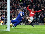 Robin Van Persie scores his team's second during the match against Everton on February 10, 2013