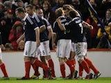 Scotland players celebrate following Charlie Mulgrew's goal in their match against Estonia on February 6, 2013
