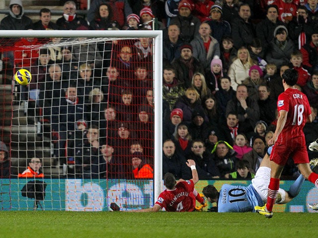 Manchester City forward Edin Dzeko scores against Southampton on February 9, 2013