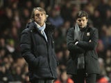 Manchester City manager Roberto Mancini and Southampton manager Mauricio Pochettino watch their side's in action on February 9, 2013