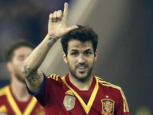 Fabregas, Pedro ease Spain past Uruguay