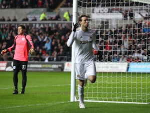 Swansea City forward Michu celebrates after scoring his side's first goal against QPR on February 9, 2013