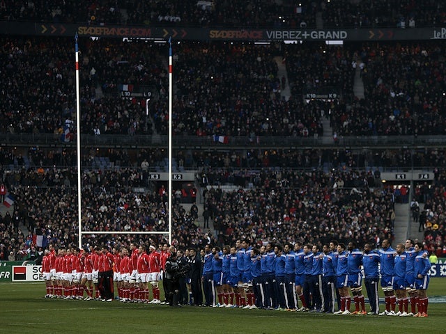 Welsh and French players line-up for the national anthems before the Six Nations match on February 9, 2013