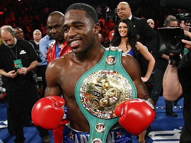 Adrien Broner celebrates after knocking off Gavin Rees in the 5th round of their WBC lightweight title match on February 17, 2013