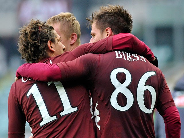 Torino's Valter Birsa is congratulated by team mate Alessio Cerci after scoring the winner against Atalanta BC on February 17, 2013