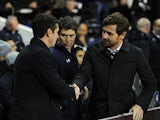 Tottenham Hotspur boss Andre Villas-Boas shakes hands with Lyon boss Remi Garde before kick-off on February 14, 2013