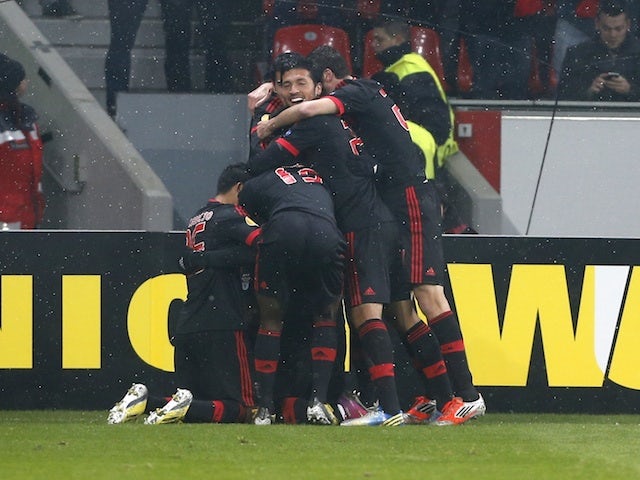 Benfica players celebrate a goal by Oscar Cardozo on February 14, 2013