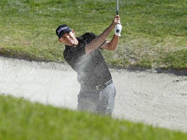 Bill Haas hits from the bunker during the final round of the Northern Trust Open golf tournament on February 17, 2013