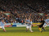 Wigan's Callum McManaman scores the opener during the FA Cup 5th round against Huddersfield on February 17, 2013