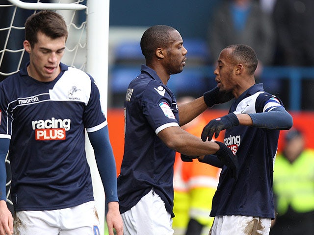 Millwall's Dany N'Guessan is congratulated by team mates after scoring his team's third in the FA Cup 5th round tie against Luton on February 16, 2013