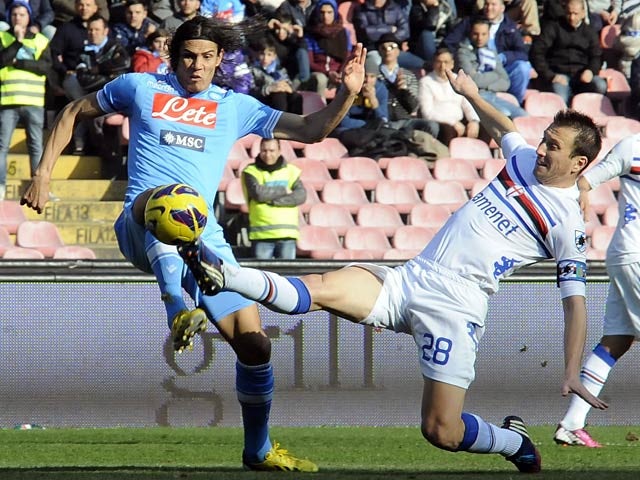 Napoli's Edinson Cavani and Sampdoria's Daniele Gastaldello battle for the ball on February 17, 2013