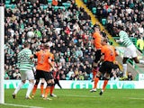 Celtic's Efe Ambrose heads in the equaliser against Dundee United on February 16, 2013