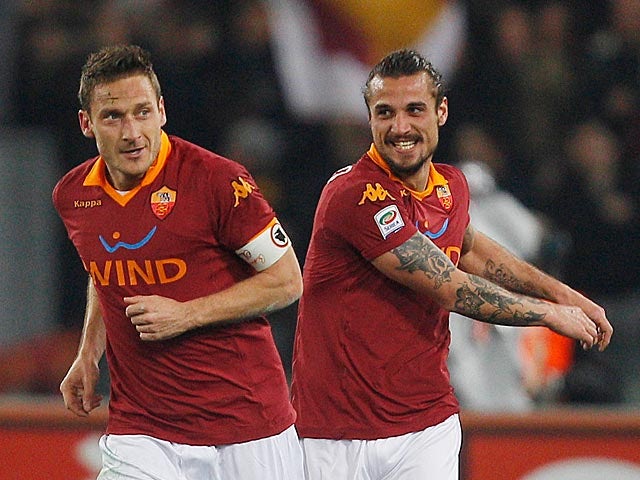Roma's Francesco Totti celebrates with team mate Pablo Osvaldo after scoring the opener against Juventus on February 16, 2013