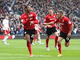 Cardiff's Frazier Campbell celebrates with team mates after scoring his second against Bristol City on February 16, 2013