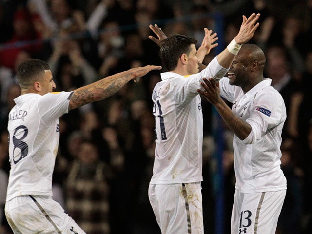Gareth Bale is congratulated by team mates Kyle Walker and William Gallas after scoring the opener in the Europa League match against Lyon on February 14, 2013