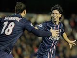 Paris Saint-Germain's Javier Pastore celebrates with team mate Zlatan Ibrahimovic after scoring his team's second against Valencia on February 12, 2013