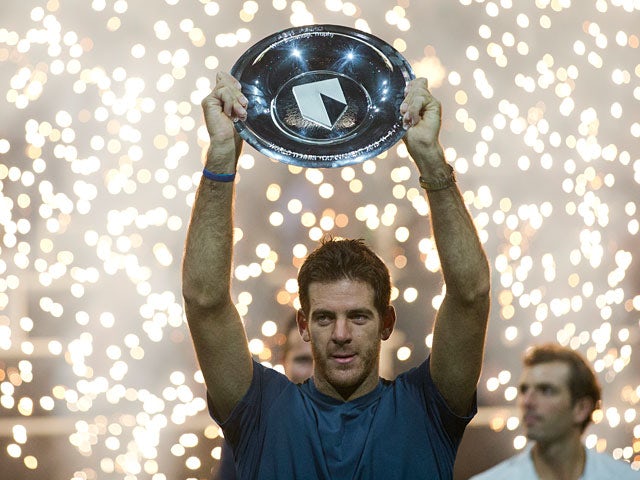 Juan Martin del Potro with the trophy after beating Julien Benneteau to win the ATP World Tour 500 indoor title in Rotterdam on February 17, 2013