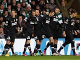 Juventus' Claudio Marchisio is congratulated by team mates after scoring the opening goal against Celtic on February 12, 2013