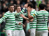 Celtic's Kris Commons is congratulated by team mates after scoring his team's second against Dundee United on February 16, 2013