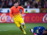 Barcelona's Lionel Messi celebrates his goal against Granada on February 16, 2013