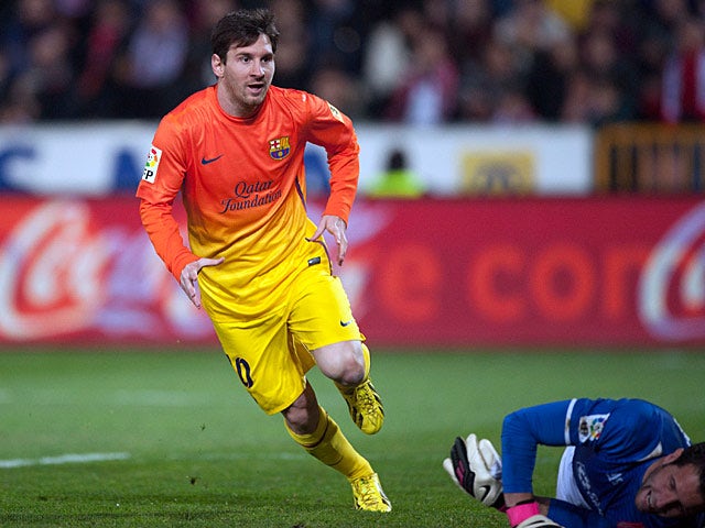 Barcelona's Lionel Messi celebrates his goal against Granada on February 16, 2013