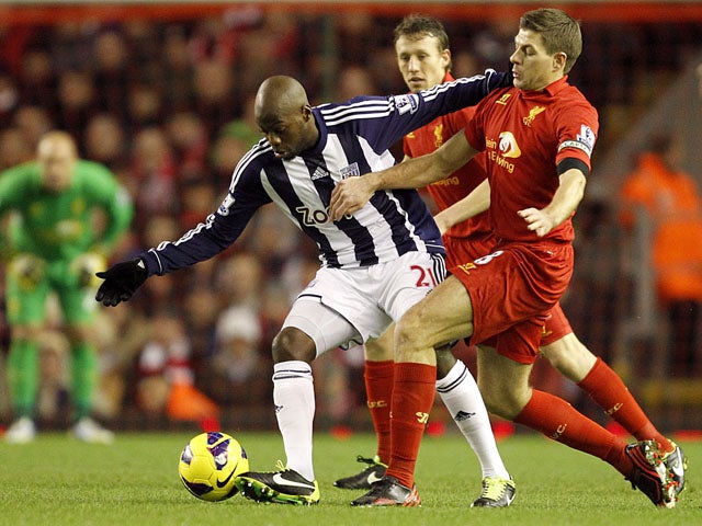 West Bromwich Albion's Youssouf Mulumbu and Liverpool's Steven Gerrard battle for the ball during their side's match on February 11, 2013