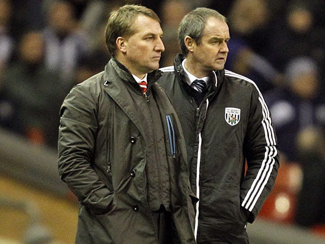 Liverpool manager Brendan Rodgers and West Brom manager Steve Clarke watch on during their teams encounter on February 11, 2013