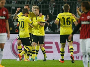 Dortmund's Marco Reus is congratulated by team mates after scoring against Frankfurt on February 16, 2013