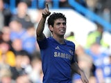 Chelsea's Oscar celebrates scoring the his team's second in the FA Cup 4th round replay against Brentford on February 17, 2013