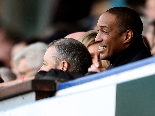 Paul Ince smiles in the directors box as he watches Blackpool play Ipswich on February 16, 2013