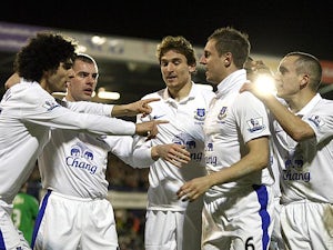 Everton's Phil Jagielka is congratulated by team mates after scoring his team's second against Oldham in the FA Cup 5th round on February 16, 2013