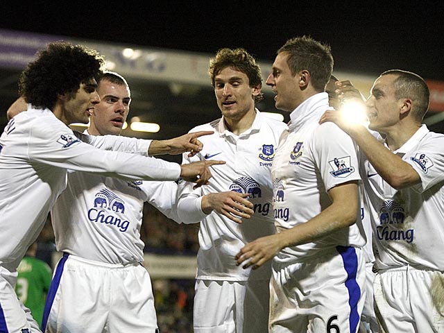 Everton's Phil Jagielka is congratulated by team mates after scoring his team's second against Oldham in the FA Cup 5th round on February 16, 2013