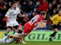 London Welsh's Phil MacKenzie dives over to score a try against Sale Sharks on February 17, 2013