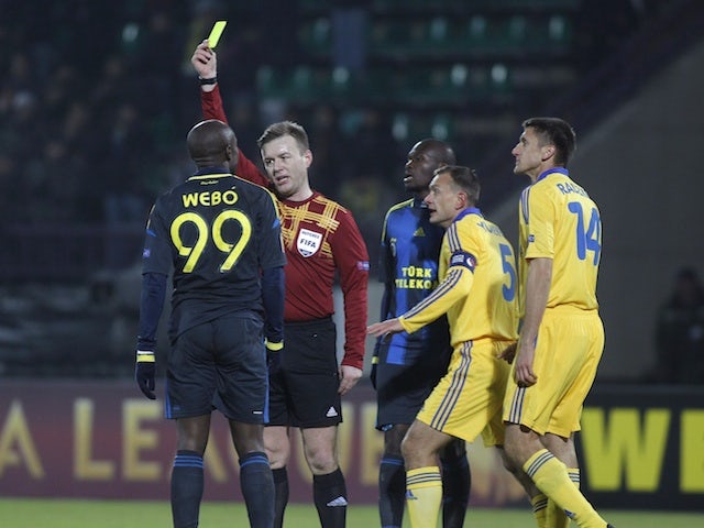 Fenerbahce's Pierre Webo receives a booking against Bate on February 14, 2013
