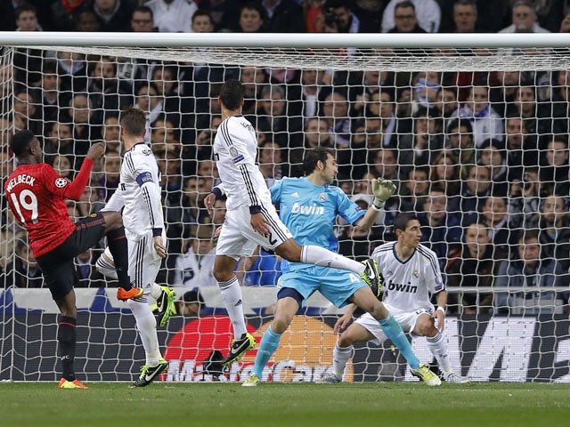 Manchester United's Danny Welbeck scores his side's first goal against Real Madrid on February 13, 2013