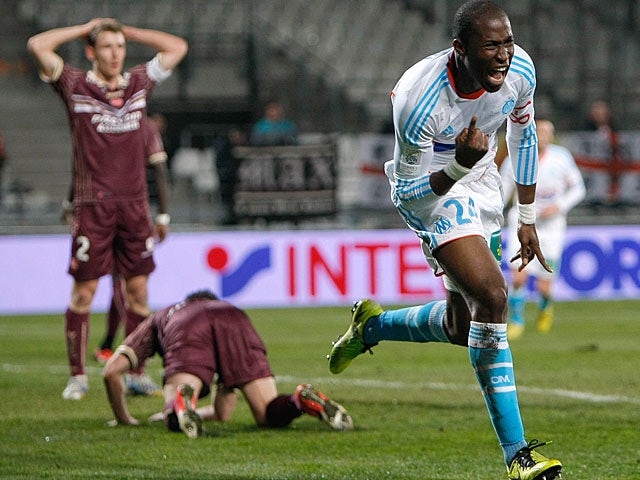 Marseille defender Rod Fanni celebrates after scoring against Valenciennes on February 16, 2013