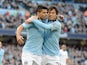 Manchester City's Sergio Aguero is congratulated by David Silva after scoring a penalty against Leeds in the FA Cup 5th round on February 17, 2013