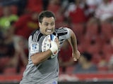 Zealand's Hurricanes Tim Bateman runs with the ball during their Super Rugby match against Lions on March 2, 2012