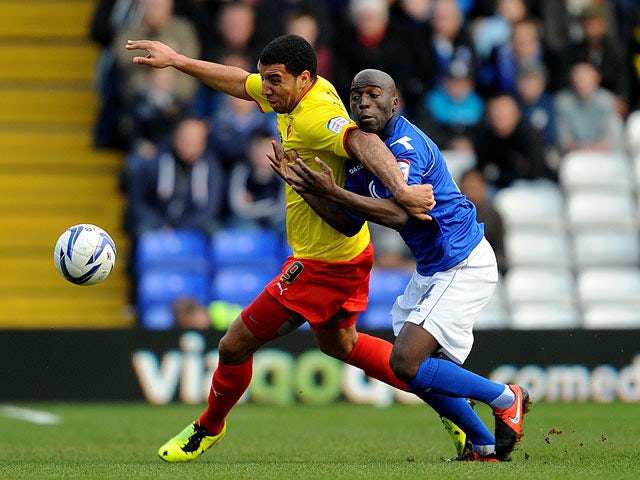 Watford's Troy Deeney and Birmingham's Morgaro Gomis battle for the ball on February 16, 2013