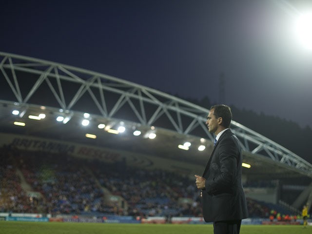 Wigan manager Roberto Martinez watches his side in action against Huddersfield during their FA Cup fifth round match on February 17, 2013