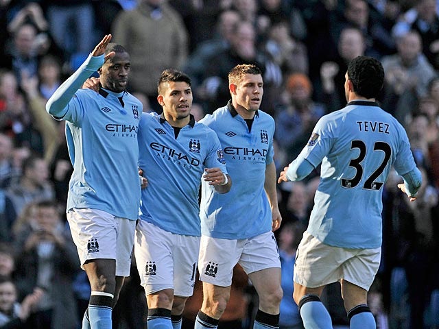 Manchester City's Yaya Toure is congratulated by team mates after scoring the opener against Leeds in the FA Cup 5th round on February 17, 2013