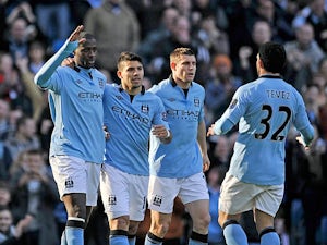 Manchester City's Yaya Toure is congratulated by team mates after scoring the opener against Leeds in the FA Cup 5th round on February 17, 2013