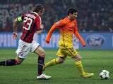 Barcelona's Lionel Messi is chased by AC Milan's Massimo Ambrosini during the two sides Champions League match on February 20, 2013