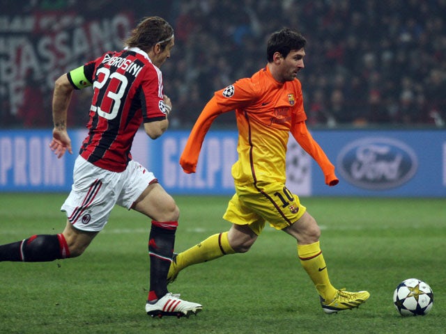 Barcelona's Lionel Messi is chased by AC Milan's Massimo Ambrosini during the two sides Champions League match on February 20, 2013